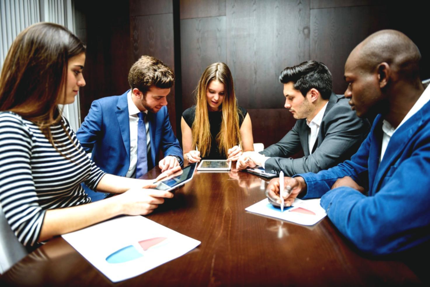 University collaboration workspace with students analyzing financial data